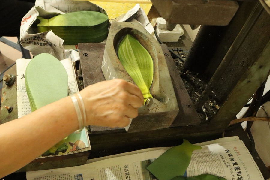 Workers assembling flower components
